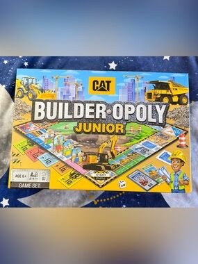 Caterpillar Builder-Opoly Junior Board Game - Yellow and Blue Box Art